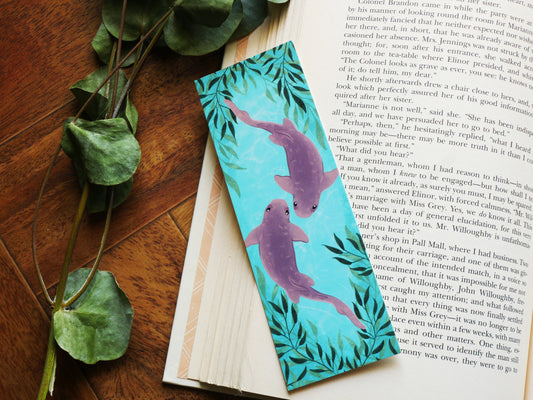 close up nurse shark bookmark on book with eucalyptus decor